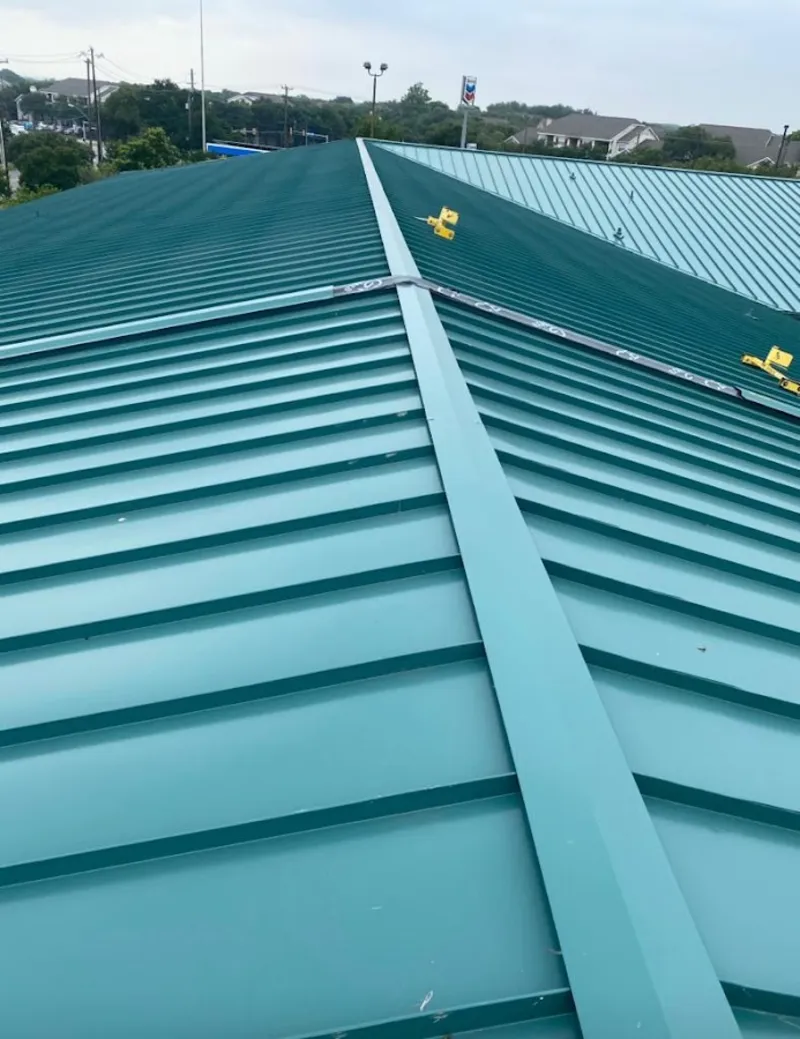 Green commercial metal roof ridge and valley for Metal Roof Repair in Forest City